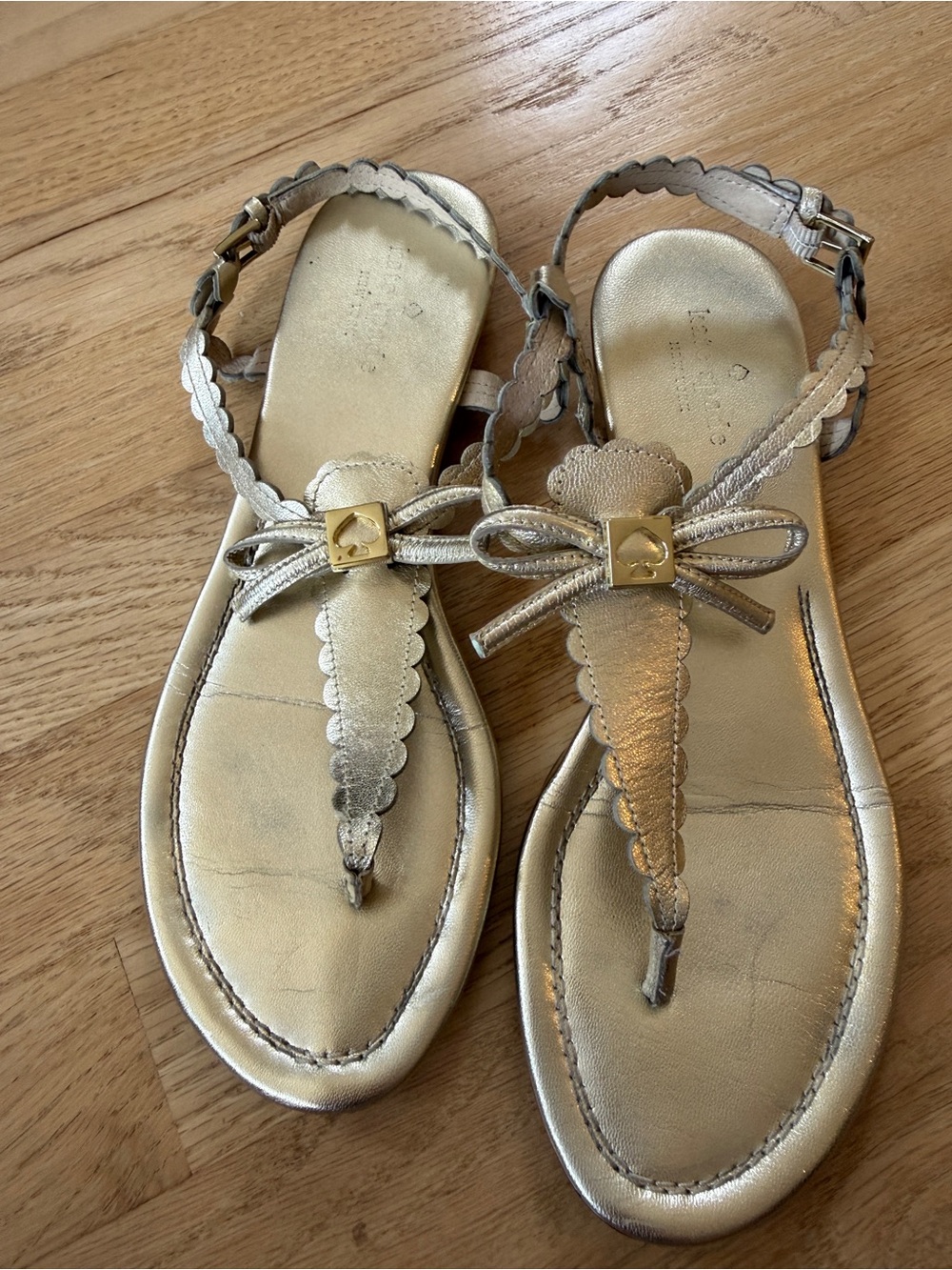 kate spade Metallic Gold Scalloped Bow T-Strap Sandals
